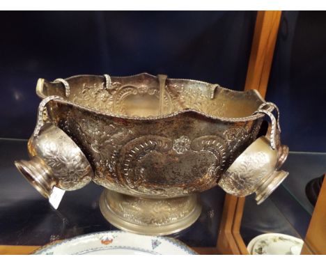 A silver-plated punch bowl complete with six cups and ladle engraved with foliate scrolls 