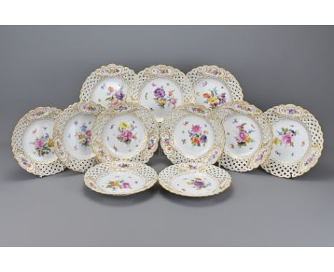 A Set of Eleven German Porcelain Plates, Meissen mark, with Gilt Details mark underneath, diameter 21 cm (11)