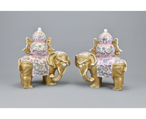 A Pair of Vintage Chinese Porcelain Famille Rose Elephant Ornaments with Qianlong seal marks. Height approx. 27 cm (2)Provena