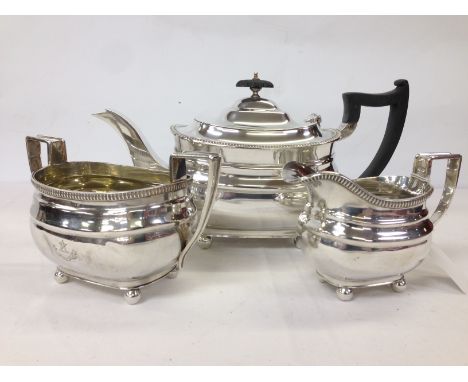 THREE PIECE SILVER TEASET (ENGRAVED WITH CREST) SHEFFIELD WALKER AND HALL 