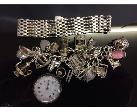 A SILVER FOB WATCH, A SILVER CHARM BRACELET AND A SILVER GATE BRACELET