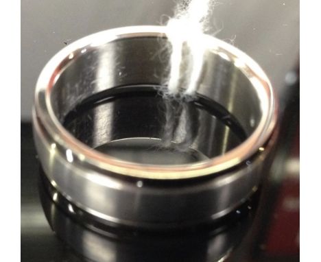 TITANIUM RING WITH CENTRAL FROSTED BAND AND POLISHED EDGES SET WITH BRILLIANT CUT DIAMONDS 