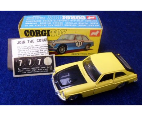 A Corgi Toys 345 MGC GT Competition Model, yellow body, black bonnet, boot and interior, wire wheels, suitcase, RN labels, in