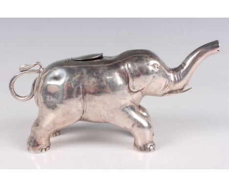 An Edwardian silver novelty creamer in the form of an elephant with trunk raised, import mark Chester 1909 by Berthold Müller