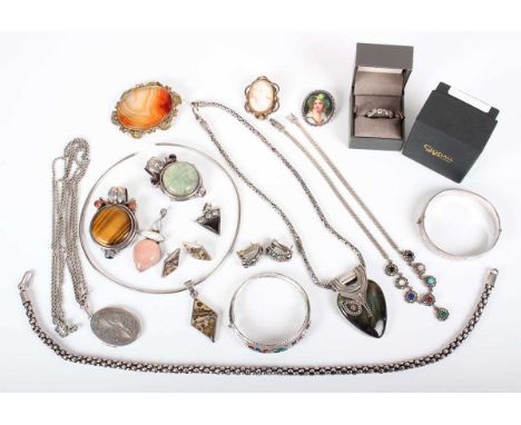 A group of mostly silver and gem set jewellery, including an oval hinged bangle with engraved decoration, Birmingham 1975, in