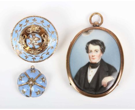 A Victorian yellow metal and pale blue enamelled circular brooch, the centre mounted with a half-pearl, otherwise decorated w