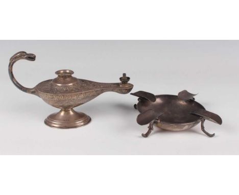 A George V silver novelty table lighter in the form of Aladdin's lamp, engraved with foliate scrolls, the scroll handle with 