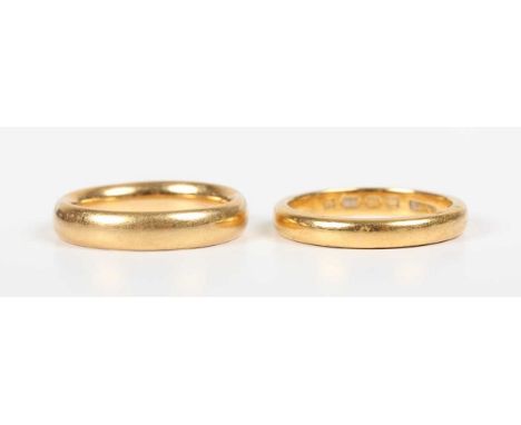 A 22ct gold wedding ring, London 1928, ring size approx K, and another gold wedding ring, detailed ‘22’, ring size approx J, 