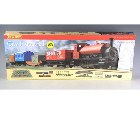 Three Hornby gauge OO goods train sets, comprising R.1157 West Coast Highlander, R.1127 City Industrial and R.1101 The Blue H