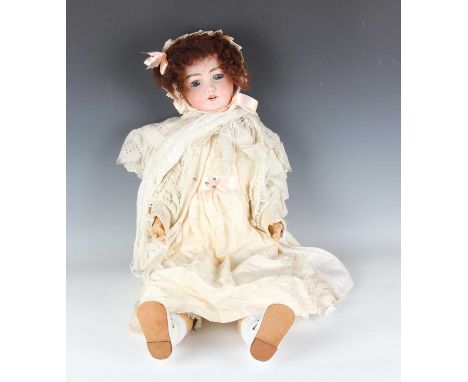 A Simon &amp; Halbig bisque head doll, impressed 'S H 1079 DEP 15 Germany', with later brown wig, sleeping blue eyes, painted