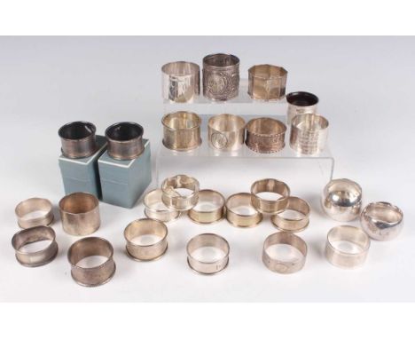 A group of six silver engine turned napkin rings, Birmingham 1951 and 1952, together with seventeen other silver napkin rings