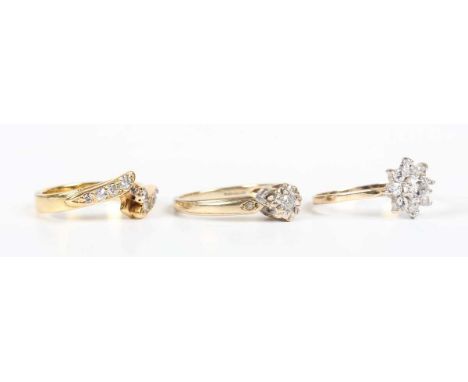 An 18ct gold and diamond ring in a twistover design, weight 4.6g, ring size approx K, a 9ct gold and diamond ring and a 9ct g