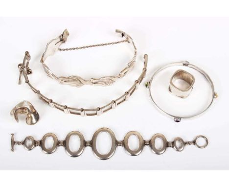 A group of mostly silver jewellery, comprising a varicoloured gemstone set circular bangle, unmarked, inside diameter 5.9cm, 