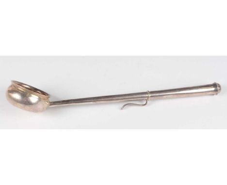 A George I silver punch ladle, the circular bowl engraved with initials, flanked by a tapering handle fitted with a hook, Lon