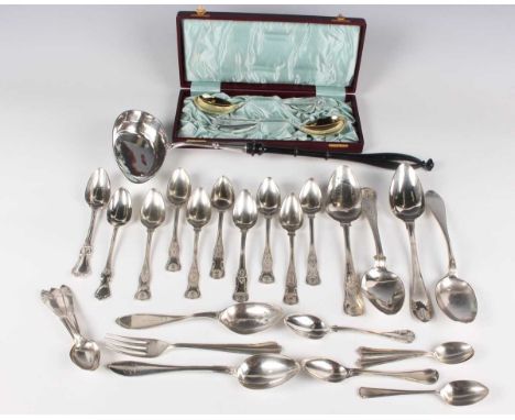 A group of Swedish silver cutlery, including a ladle with an oval bowl and fitted with an ebonized turned wood handle, length