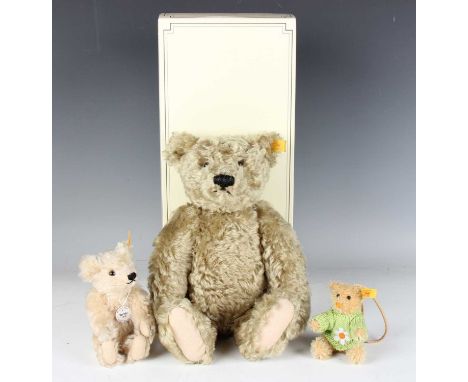 A modern Steiff Classic teddy bear, No. 000737, boxed with loose tags, together with two small Steiff teddy bears.