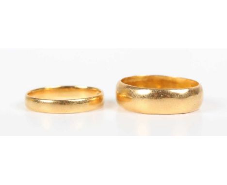 A Victorian 22ct gold wedding ring, London 1889, ring size approx I, and another 22ct gold wide band wedding ring, London 196