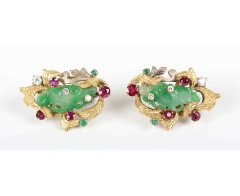 A pair of Middle Eastern gold, diamond, ruby and jade earrings, each mounted with a carved and pierced central jade, otherwis