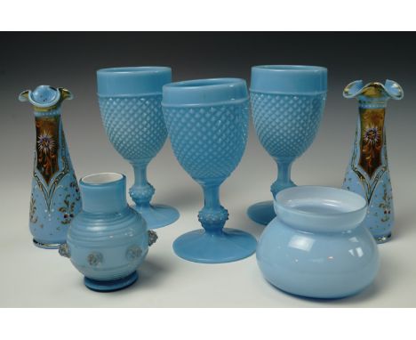 Victorian blue glassware comprising, three moulded goblets, a pair of blue glass stem vases with applied enamel decoration, a