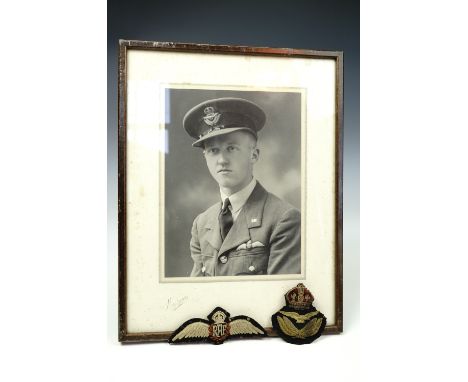 A portrait of an unidentified RAF Volunteer Reserve pilot, together with a set of pilot's qualification wings and an officer'