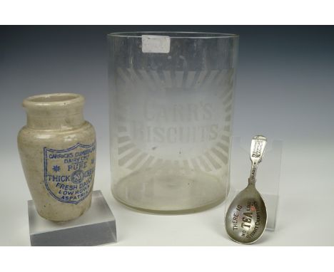 An early 20th century Carr's Biscuits etched counter top jar, (a/f), a Carrick's Cumberland Dairy cream pot, and a 'There is 