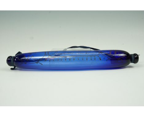 A Victorian cobalt blue glass rolling pin, enamelled in depiction of a fowled anchor and sailing ship, together with the apho