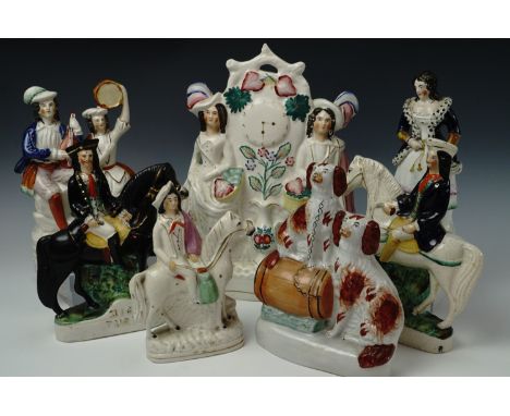 Seven 19th century Staffordshire flatbacks, comprising Dick Turpin, Tom King, a flatback clock and other figures