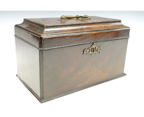 A George III mahogany three compartment tea caddy, cavetto moulding to the top with ebonised beading and quadrant corner moul