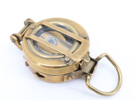 A military style brass lensatic marching compass