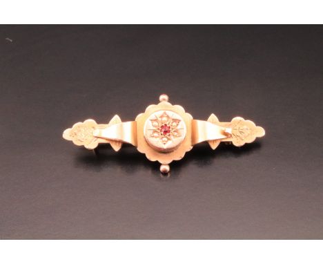 A cased Victorian 9 ct yellow metal, pink stone as seed pearl bar brooch, 4 cm, 1.7 g