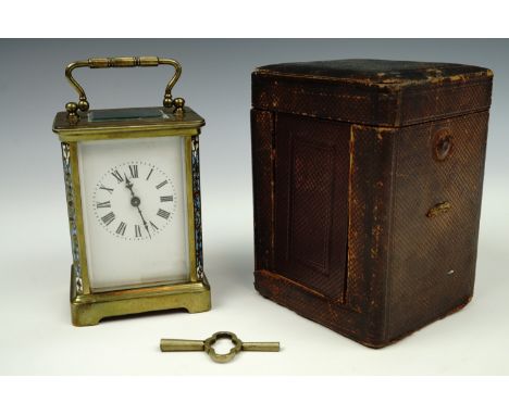 A late 19th / early 20th Century French champleve enamelled carriage clock, cased, 11 cm excluding handle, (running when case