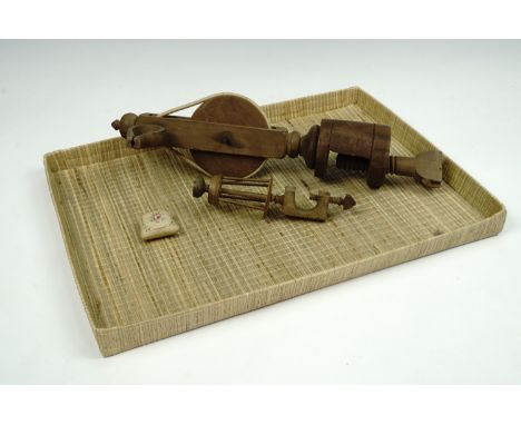 An early 20th century turned wood table mounted thread winder and a lace bobbin winder