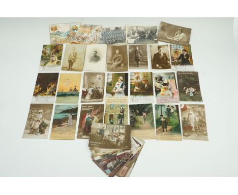 A quantity of Great War Bamforth's series' sentimental and patriotic postcards, together with military photographic portrait 