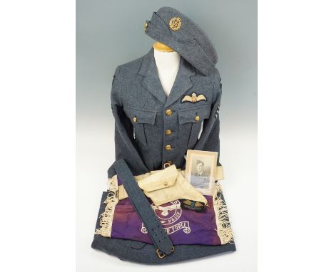 A brown hide suitcase containing a believed associated group of RAF clothing and other items including an RAF Volunteer Reser