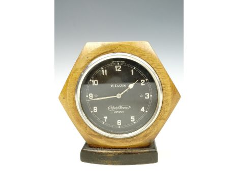 A Cooper Stewart Swiss fascia clock on a turned and ebonised base, face 8 cm, second quarter 20th Century