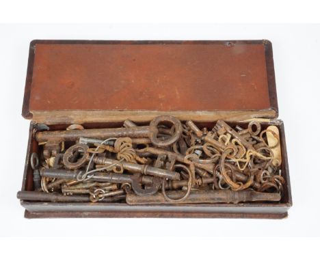 A large quantity of 19th century and later watch, clock and other keys in a leather box