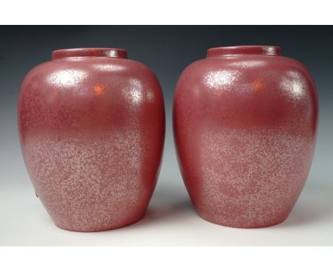 A pair of late 20th century Poole Pottery mottled pink vases of bulbous form, 22 cm