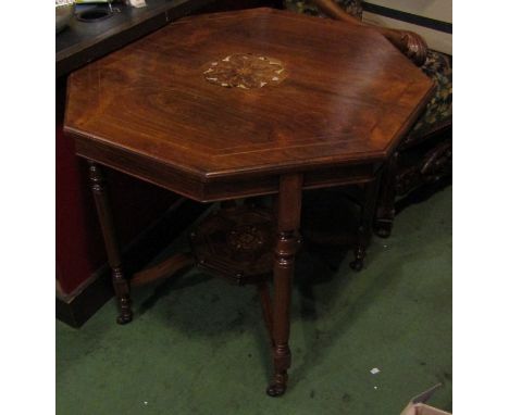 A Victorian inlaid rosewood two tier centre table the octagonal top over turned legs and ceramic castors, 71cm tall x 75cm wi