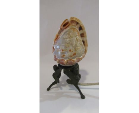 A carved cameo shell lamp with cast metal base, 19cm tall