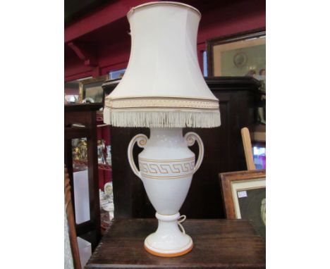 A ceramic twin handled table lamp with shade