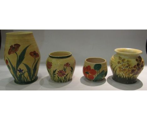 Four Radford pottery vases, poppy vase 18cm tall, Meadow flower 11cm tall and two smaller examples all yellow ground with flo