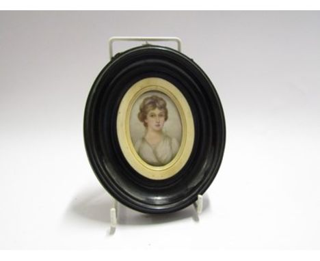 A 19th Century miniature portrait of aristocratic female, wearing white silk dress, oval frame, 7cm tall  