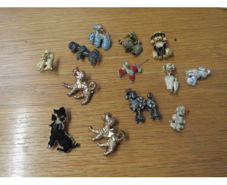 13 poodle brooches mostly metal bodied some with enamel detail 