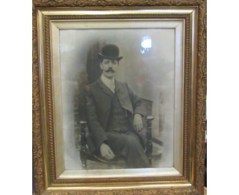 An early 20th Century photographic portrait of handsome gentleman with moustache and bowler hat in highly ornate frame, 71cm 