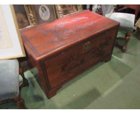 A mid 20th Century Southeast Asia camphor wood trunk with carved decoration and sliding tray (with lock), 101cm x 55cm x 56cm