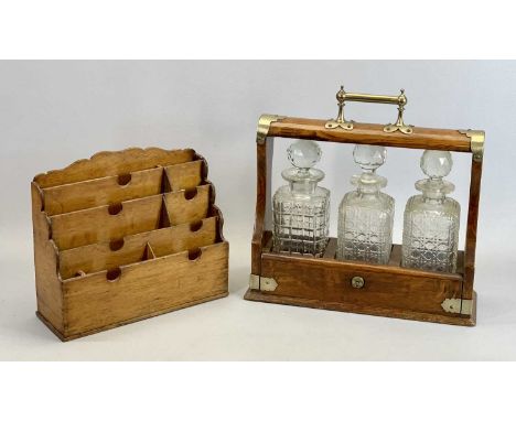 EDWARDIAN OAK 3 BOTTLE TANTALUS - with EPNS mounts, containing three square cut glass decanters with stoppers, 37cms H, 37cms