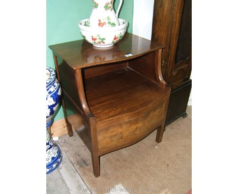 A superb Georgian Mahogany Commode Chest having serpentine front with upper lifting shelf, on swept curved supports, over low