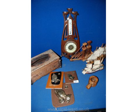 A box of treen including Arts and Crafts Barometer, wooden handkerchief box, wooden boats, etc