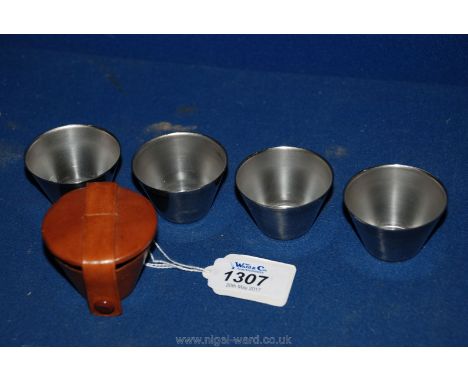 A set of hunting Stirrup Cups in leather case