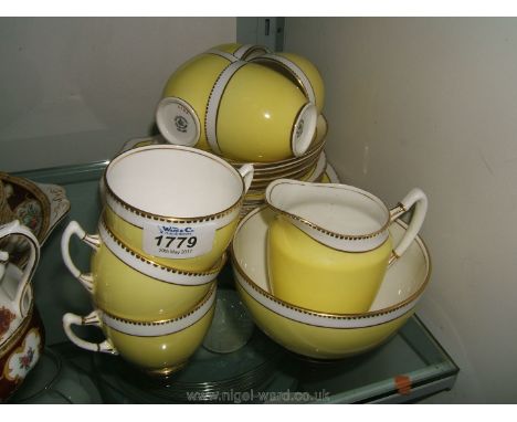 A Royal Albert Tea Service decorated in yellow with gilt borders
